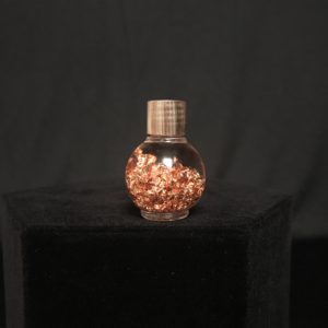 copper flakes in liquid