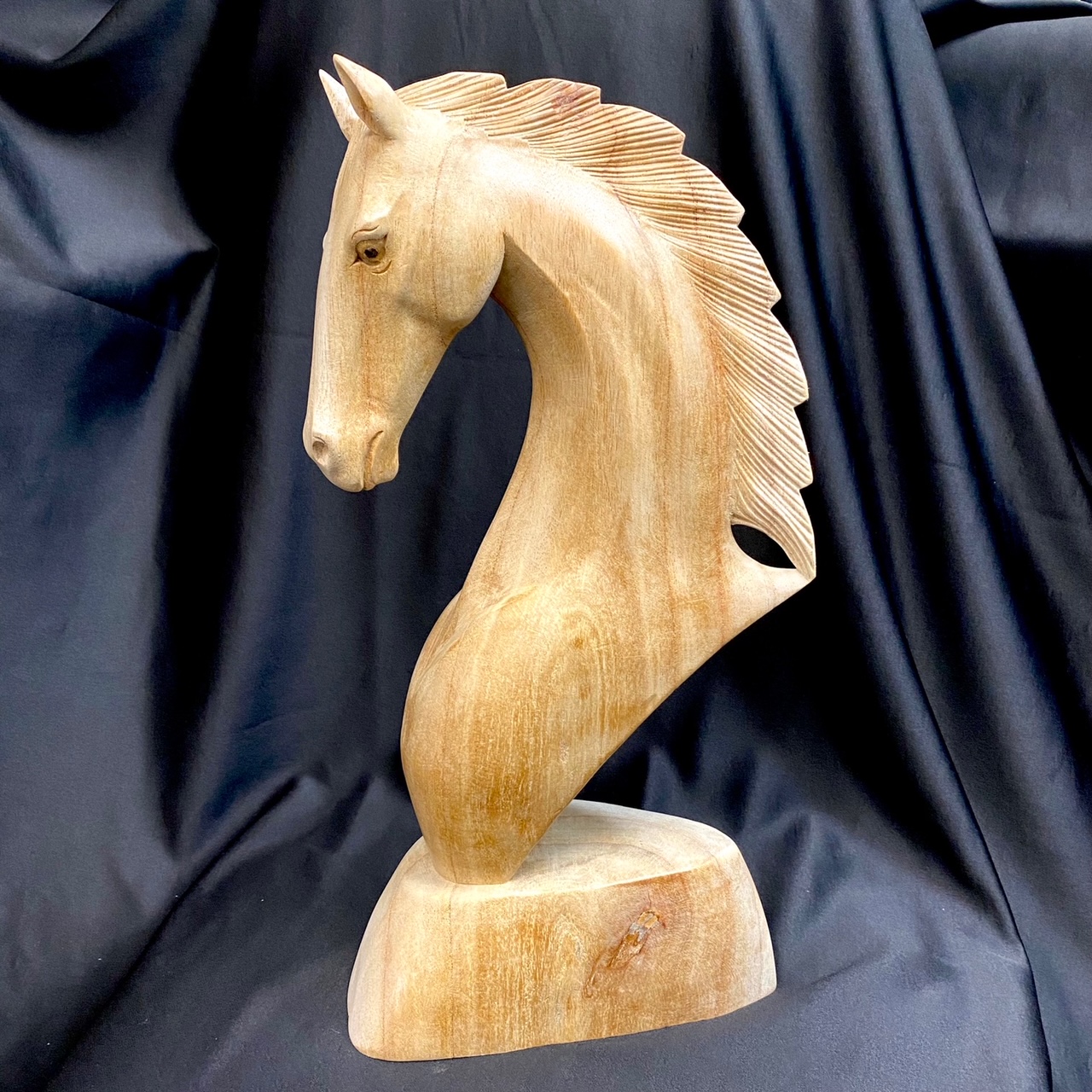 Handsome, hand carved, wooden horse head, at natur showroom