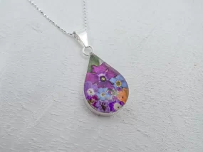 Flower jewelry, Miniature flowers set in acrylic and Sterling Silver, Teardrop Medium on an 18" sterling silver faceted bolitas chain.